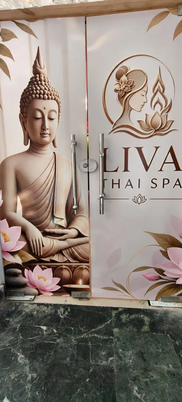 Spa entrance with Buddha artwork and logo at Liva Thai Spa